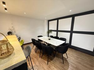 a dining room with a table and chairs at Mujito3 4BR 16PAX InTown, PoolTable, PS4, Netflix in Kuantan +16 photos