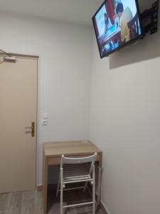 TV a/nebo společenská místnost v ubytování Ardenn'Hotel