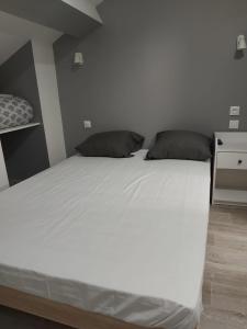 Postel nebo postele na pokoji v ubytování Ardenn'Hotel