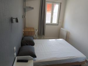 Postel nebo postele na pokoji v ubytování Ardenn'Hotel