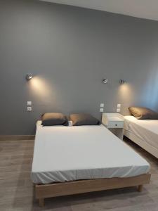 Postel nebo postele na pokoji v ubytování Ardenn'Hotel