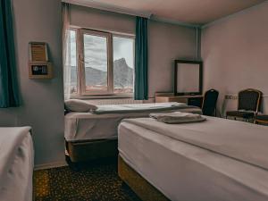 a hotel room with two beds and a window at Oreko Express in Afyon