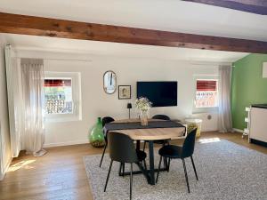a dining room with a table and chairs at The New Place in Ferrara