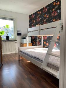 a white bunk bed in a room with a wall at Ronneby Torneryd Retreat in Ronneby