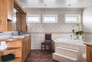 a bathroom with a tub and a sink and a bath tub at Ronneby Torneryd Retreat in Ronneby +71 photos