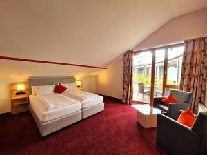 Ένα ή περισσότερα κρεβάτια σε δωμάτιο στο Mosers Blume Relax & Genuss Hotel +104 φωτογραφίες