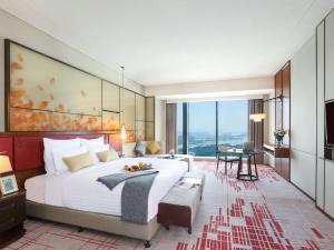 Voodi või voodid majutusasutuse Pullman Huizhou Kaisa toas