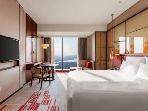 Voodi või voodid majutusasutuse Pullman Huizhou Kaisa toas