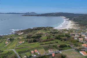 an aerial view of a beach and the ocean at Casa de Pili - by entreRías in Cangas de Morrazo