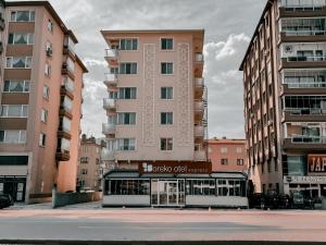 a tall building with a store in front of it at Oreko Express in Afyon