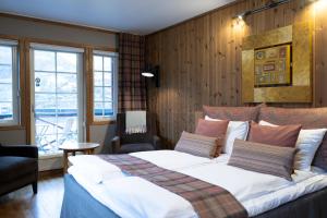 Postel nebo postele na pokoji v ubytování Flåmsbrygga Hotel