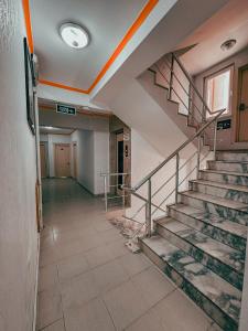 an empty hallway with stairs in an office building at Oreko Express in Afyon