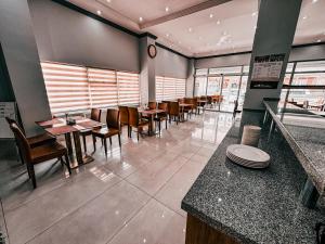a dining room with tables and chairs in a restaurant at Oreko Express in Afyon