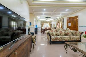 a living room with a couch and a table at Panglao villa family reunions in Panglao