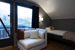 Postel nebo postele na pokoji v ubytování Flåmsbrygga Hotel