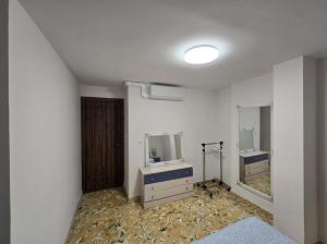 Ένα ή περισσότερα κρεβάτια σε δωμάτιο στο Desigual apartamento con 3 AC