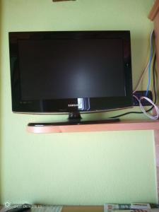 TV a/nebo společenská místnost v ubytování Casa Vacanze Chez Sapin