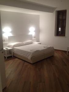 Postel nebo postele na pokoji v ubytování Hotel Il Pirata