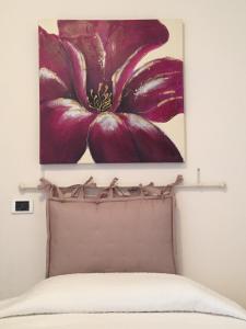 A bed or beds in a room at Hotel Villa San Fedele