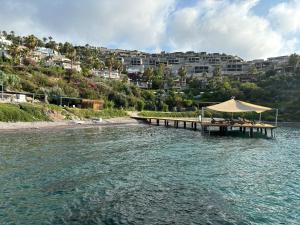 a dock with a tent in the middle of the water at Selinshouse in Bodrum City