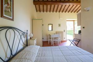 Posteľ alebo postele v izbe v ubytovaní Il Castellaro Country House