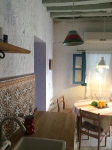 a kitchen with a table and a dining room at Rhodes Summer House in Gennadi