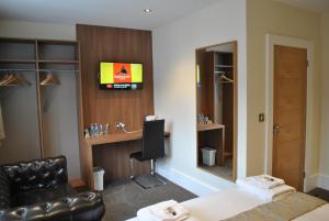 TV a/nebo společenská místnost v ubytování Dreams Hotel