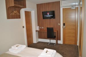 TV a/nebo společenská místnost v ubytování Dreams Hotel