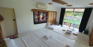 Postel nebo postele na pokoji v ubytování Cassiopeia Srithanu Apartments