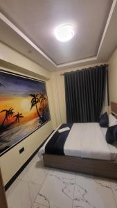 Postel nebo postele na pokoji v ubytování EQUATOR SUITES -KAMPALA -Ivory Mall -Bunga Gaba Road