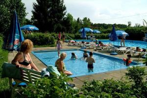 a group of people in a swimming pool at Camping Schüttehof in Horb am Neckar