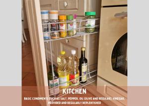 an open refrigerator door with bottles of alcohol at Pardubsky Apartments in Ljubljana +18 photos
