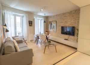 a living room with a couch and a table at Zapatería 30 by Clabao in Pamplona