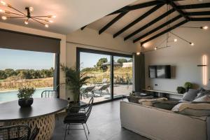 a living room with a couch and a table at Chrysa by Vintage Travel in Lakithra