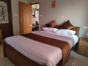 Ένα ή περισσότερα κρεβάτια σε δωμάτιο στο Bethel Serviced villas