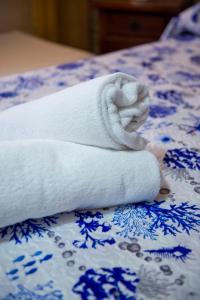 Postel nebo postele na pokoji v ubytování B&B Appartamenti l'Anfora