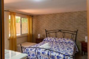 Postel nebo postele na pokoji v ubytování B&B Appartamenti l'Anfora