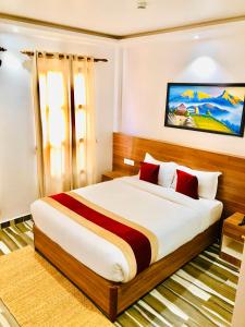 A bed or beds in a room at Manigram Bishram Batika Pvt Ltd