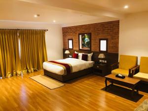 A bed or beds in a room at Manigram Bishram Batika Pvt Ltd