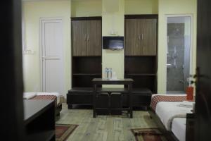Ένα ή περισσότερα κρεβάτια σε δωμάτιο στο Hotel Arhant Inn