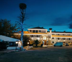 a building with a car parked in front of it at Amrouss touristic DarMaroc in Azrou