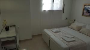 Postel nebo postele na pokoji v ubytování Rooms Valentino