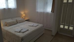 Postel nebo postele na pokoji v ubytování Rooms Valentino