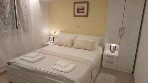 Postel nebo postele na pokoji v ubytování Rooms Valentino