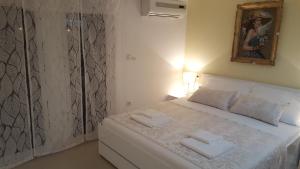 Postel nebo postele na pokoji v ubytování Rooms Valentino