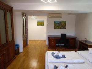 Postel nebo postele na pokoji v ubytování Margaréta Apartman és Üdülőház + 37 fotografií