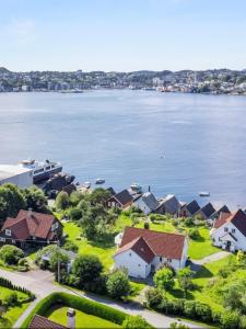 an aerial view of houses and the water at Short way to city centre and Aker Solutions! in Stord