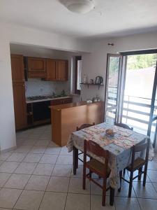 a kitchen and dining room with a table and chairs at Home Friends in Camigliatello Silano