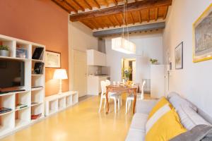 a living room with a couch and a table at San Martino Suite in Pisa