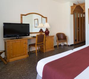 TV a/nebo společenská místnost v ubytování Hotel MS Tropicana